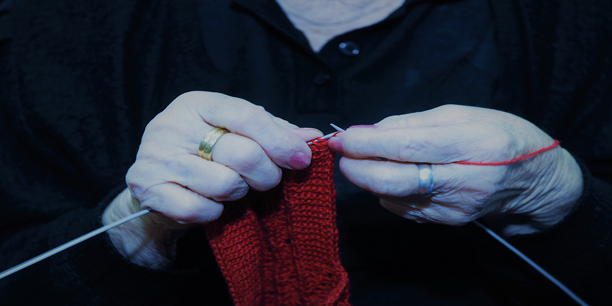 Old Woman knitting